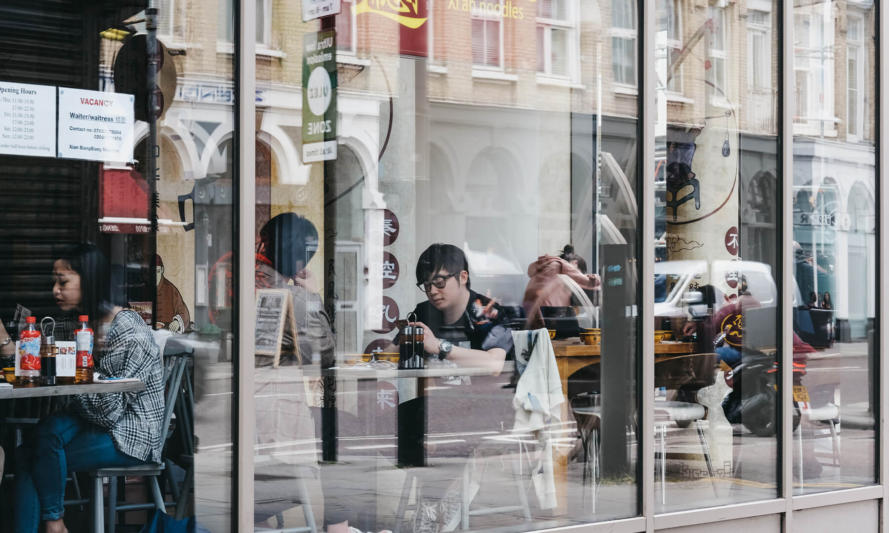 Diners eating in a chinese restaurant in shoreditch 