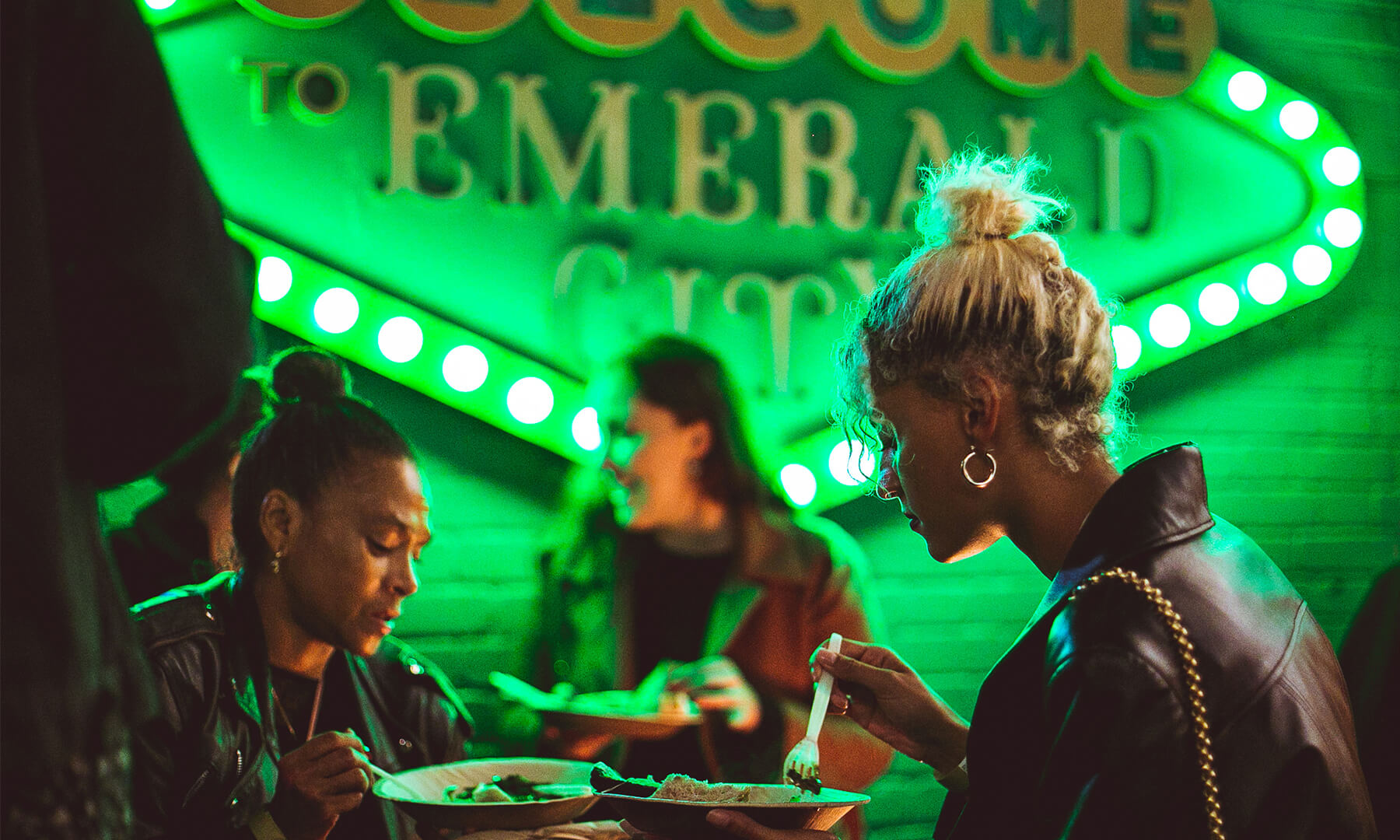 Two people eating street food in Shoreditch