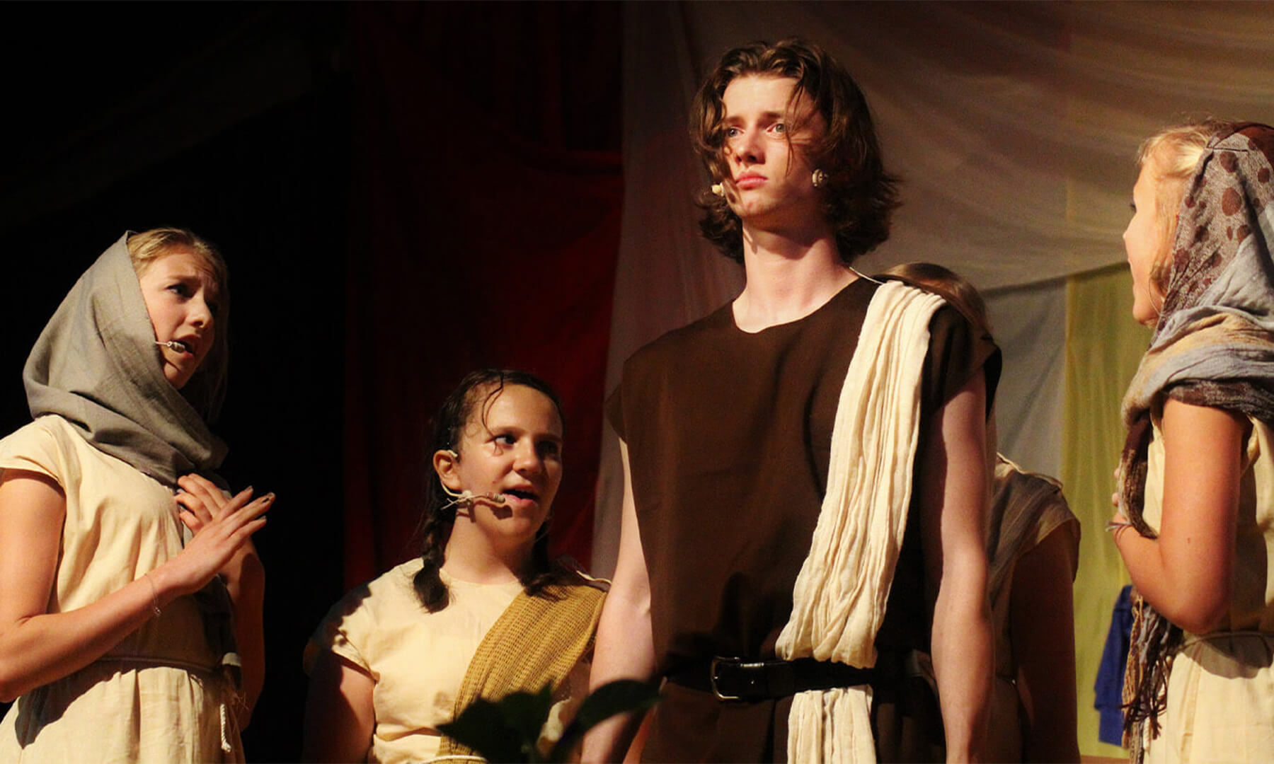 Actors on stage in a play.
