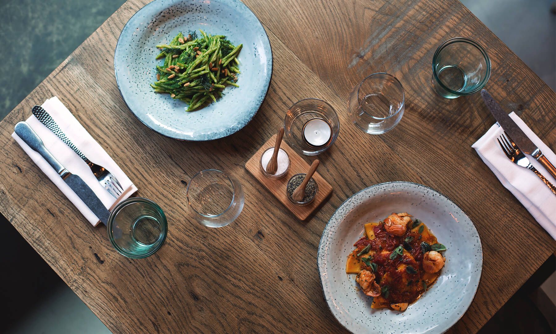 Two plates of food on a table in Passo restaurant