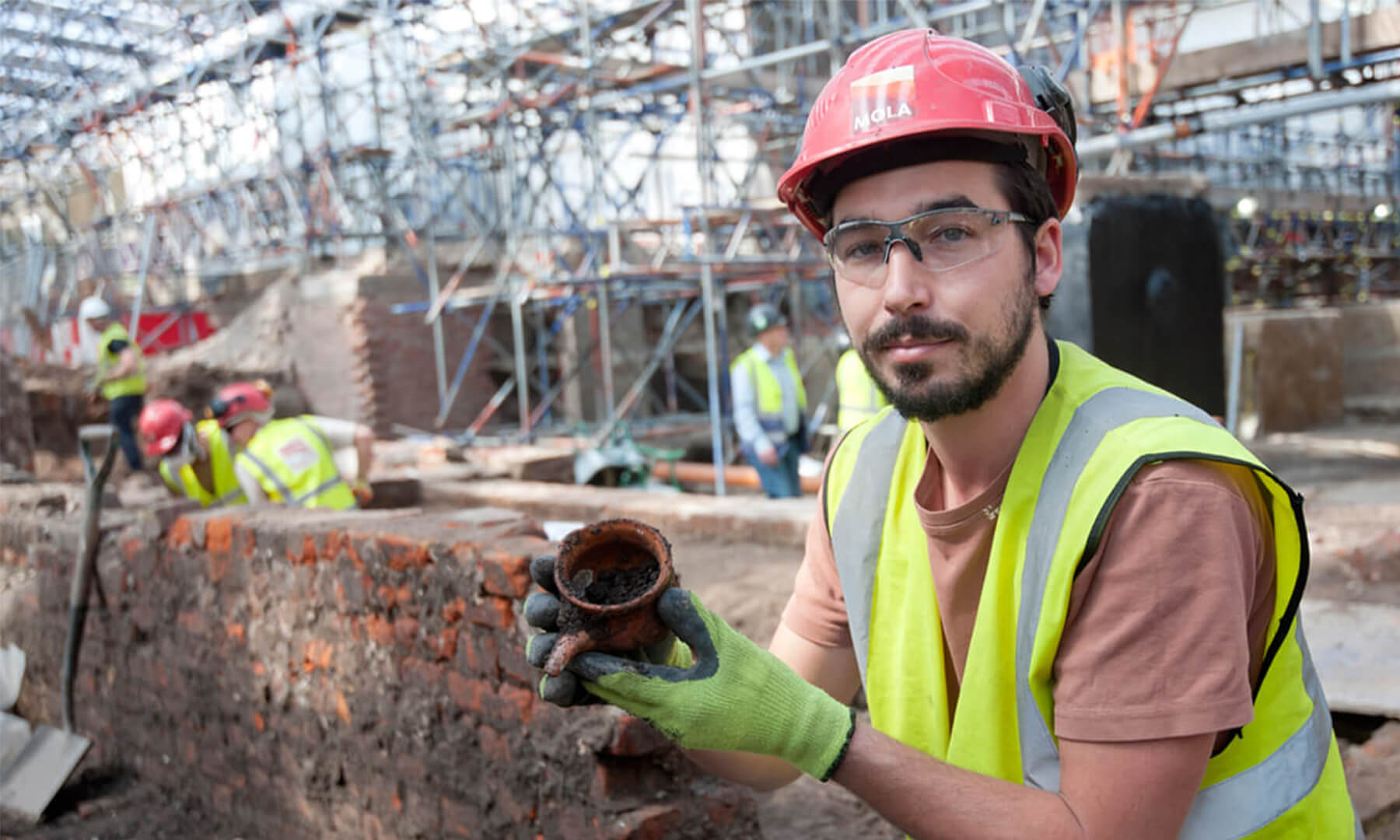 An archaeologist at the Curtain Theatre site, the original theatreland of London